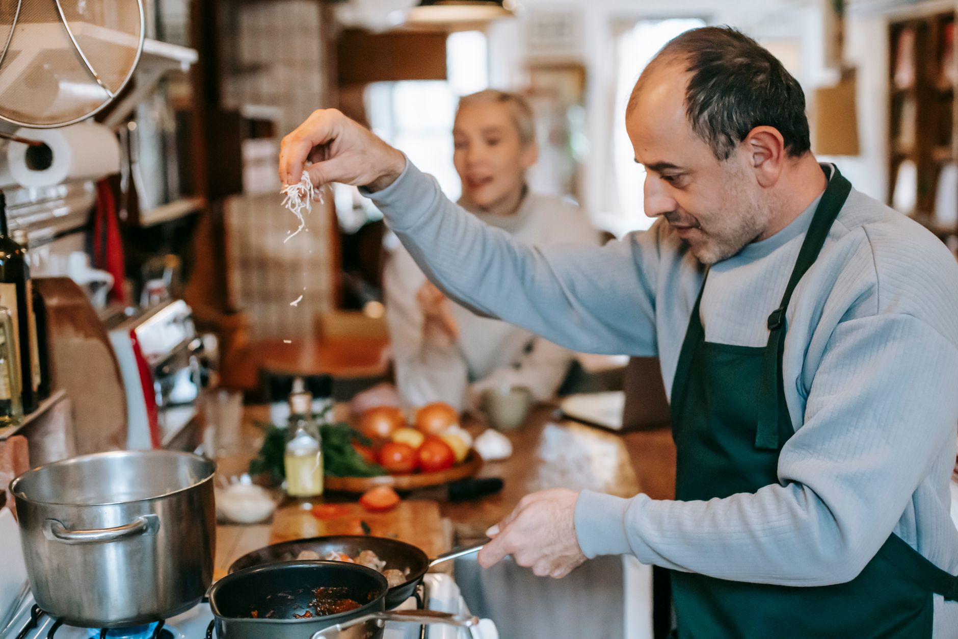 A man cooking in a home kitchen